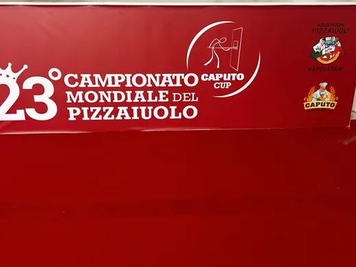 Red wall graphic for the 23rd Campionato Mondiale del Pizzaiuolo and Caputo Cup