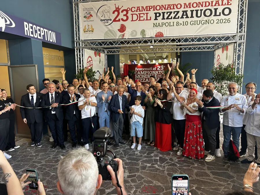 Crowd cheering during the ribbon cutting for the 23rd Campionato Mondiale del Pizzaiuolo in Naples