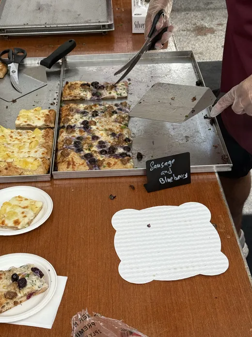 Roman-style al taglio squares being portioned at the Bonci table