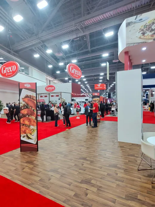 Pizza Expo show floor stretching into the distance, booths and banners everywhere