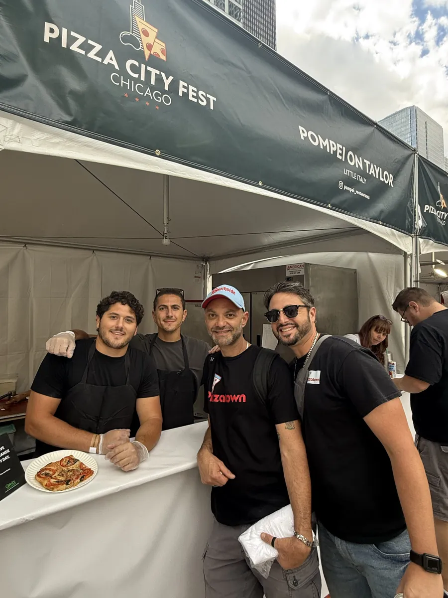 The Viviribros with the Pompei team under the Pompei On Taylor tent at Pizza City Fest